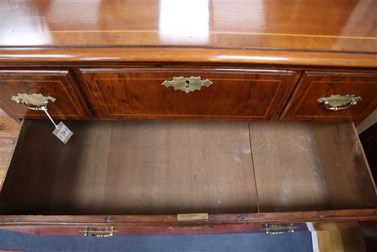 A George III walnut chest of drawers, on bun feet W.101cm